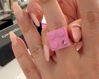 Light Pink LEGO® brick 2x2 with a Pink SWAROVSKI® crystal on a Silver/Gold plated adjustable ring finding
