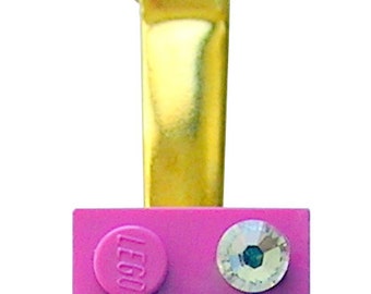 Dark Pink LEGO® brick 2x2 with a ‘Diamond’ color SWAROVSKI® crystal on a Silver/Gold hair clip (one piece)