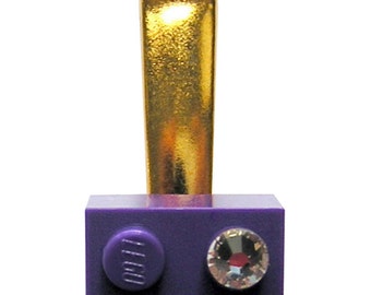 Purple LEGO® brick 2x2 with a ‘Diamond’ color SWAROVSKI® crystal on a Silver/Gold hair clip (one piece)