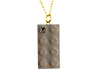 White LEGO® brick 2x4 with a 'Diamond' color SWAROVSKI® crystal on a Silver/Gold plated trace chain