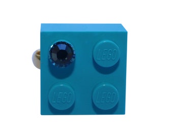 Turquoise Blue LEGO® brick 2x2 with a Blue SWAROVSKI® crystal on a Silver/Gold plated adjustable ring finding
