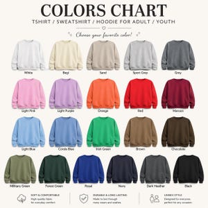 May include: A color chart for adult and youth t-shirts, sweatshirts, and hoodies. The chart displays twenty-five crewneck sweatshirts in various solid colors, including white, beige, sand, grey, pink, purple, orange, red, maroon, blue, green, brown, and black.
