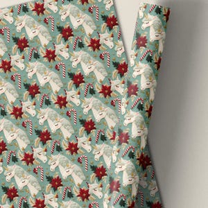 Magical unicorn Christmas gift wrap with holiday poinsettias and candy canes in a 3D embroidered effect (3 sheets)