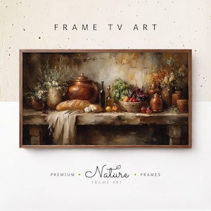 May include: A framed digital art print featuring a still life with a rustic aesthetic. The artwork depicts a wooden table laden with a copper pot, bread, vegetables, and bottles. The text "FRAME TV ART" is at the top.