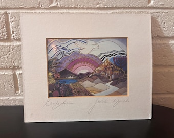 May include: A matted art print featuring a stylized landscape of Jerusalem with a white dove, a menorah, and a purple rainbow. The print includes handwritten text at the bottom reading "Birds Eye" and "Jerusalem & Symbols" on a textured white mat board.
