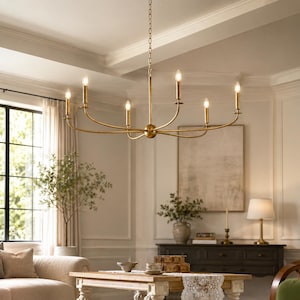 May include: A six-light chandelier featuring a central brass-toned metal frame with slender, curved arms extending outwards. Each arm holds a vertical candle-style light fixture with a small bulb, suspended from the ceiling by a matching metal chain.