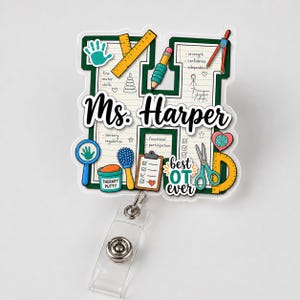 May include: A badge reel featuring a letter H shape with a notebook paper background, the name Ms. Harper, and illustrations of therapy tools including a ruler, pencil, scissors, therapy putty, and a clipboard with the text best OT ever.