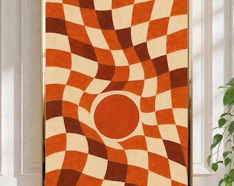 Peut inclure: Une impression d'art mural rectangulaire dans un cadre doré présentant un motif en damier ondulé et déformé dans des tons orange brûlé, brun foncé et crème. Une forme circulaire pleine orange brûlé est centrée dans la grille.