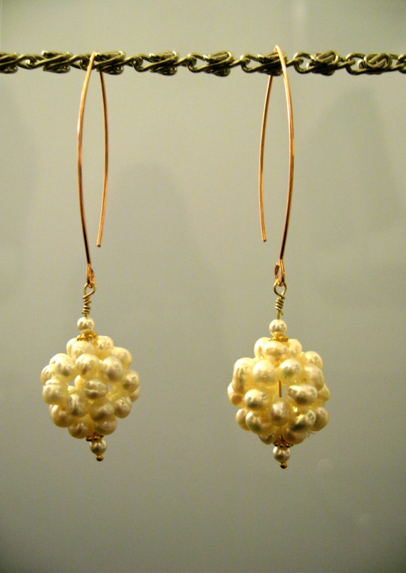 Items similar to White freshwater pearl earrings, gold bead spacers