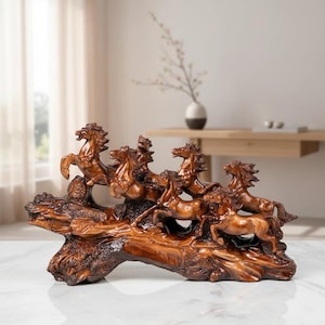 May include: A brown, polished resin sculpture depicting a group of six horses in motion, galloping across a textured, log-like base. The horses are rendered with detailed manes and muscular forms, all integrated into a single, continuous piece.