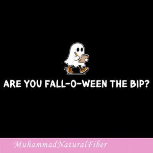 May include: A black graphic featuring a white cartoon ghost wearing orange trainers, holding a yellow pencil and a notepad. Below the ghost, the white text reads: ARE YOU FALL-O-WEEN THE BIP? The bottom of the image has a pink bar with the text MuhammadNaturalFiber.