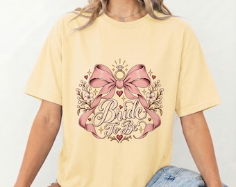 女性用花嫁Tシャツ、レトロなリボン付き花嫁グラフィックTシャツ、婚約祝いや独身最後のパーティーのギフト