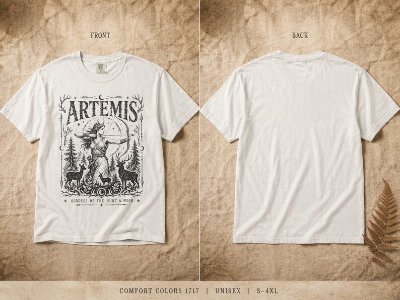 May include: White t-shirt featuring a black graphic of Artemis, the Greek goddess of the hunt, with a bow and arrow, surrounded by deer and trees. The word "ARTEMIS" is above the image. The back of the shirt is plain white.