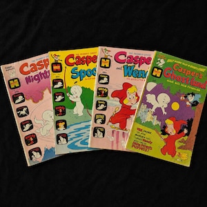 May include: Four vintage Harvey Comics featuring Casper the Friendly Ghost. Titles include Casper and Nightmare, Casper and Spooky, Casper and Wendy, and Casper's Ghostland. Each comic book cover displays colorful illustrations of Casper, Wendy, and Spooky.
