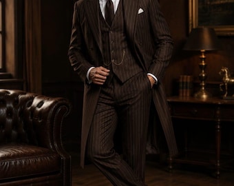 May include: A dark brown pinstripe three-piece suit featuring a long overcoat, a waistcoat with a gold pocket watch chain, a white dress shirt, and a dark brown tie. The ensemble includes matching pinstripe trousers and dark brown leather shoes.
