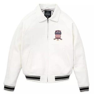 May include: A white jacket with a collared neckline and a zipper closure. The jacket features a black and white striped hem and cuffs. An embroidered emblem with the text "AVIREX" and an American flag design is on the chest.