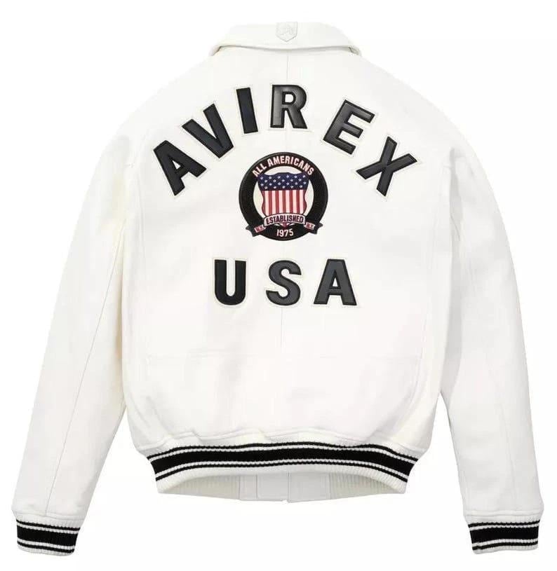 May include: White jacket with black and white striped trim and the text "AVIREX USA" on the back. The jacket features a patch with the American flag and the words "ALL AMERICANS ESTABLISHED 1975".