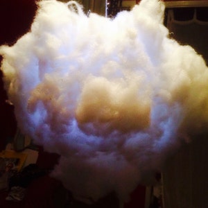 May include: A white fluffy cloud-shaped lamp with a soft, glowing light emanating from inside.