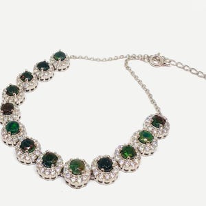 Pulsera de plata de ley con ópalo negro y detalles de diamantes suizos – Chapada en oro blanco