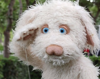 Professional Muppet-style puppet, white puppy.