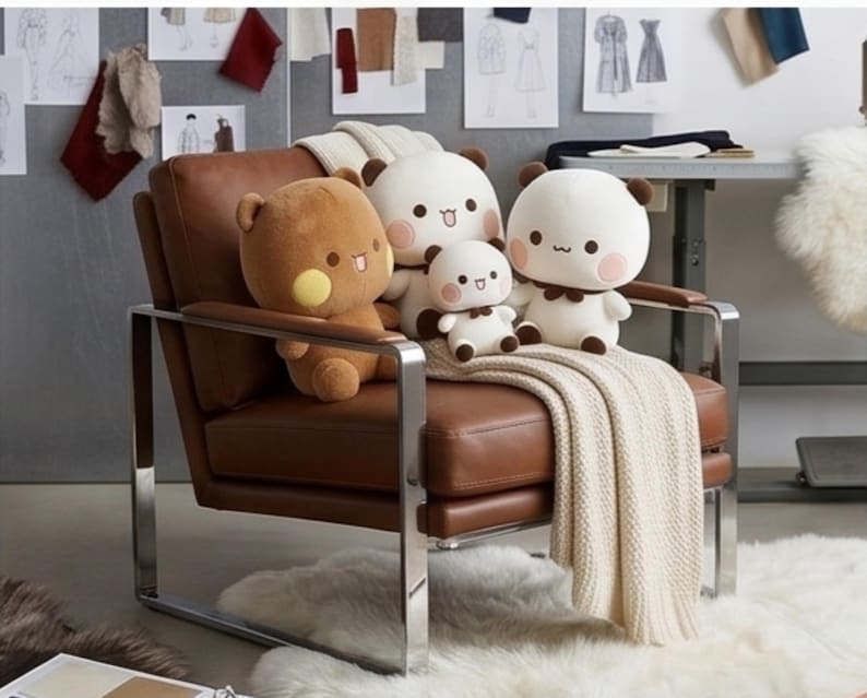 May include: A brown leather armchair with a chrome frame features four plush bear-like stuffed toys in white and brown colors. A cream-colored knitted throw blanket is draped over the seat, partially covering the cushion and the armrest.