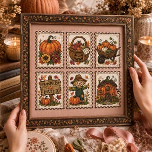 May include: A framed cross-stitch sampler featuring six rectangular panels with autumn themes, including a pumpkin, a jack-o'-lantern basket, a wheelbarrow, a sign reading PUMPKIN PATCH, a scarecrow, and a house, all set in a dark ornate frame.