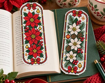 May include: Two rectangular cross-stitch bookmarks featuring holiday designs. One bookmark displays red poinsettias with green leaves and yellow ornaments. The other features white poinsettias, pine branches, red berries, and pinecones, both finished with red bows.