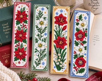 May include: Four rectangular cross-stitch bookmarks featuring floral designs. The first has red poinsettias, the second white flowers, the third red amaryllis, and the fourth red and white flowers. Each has a distinct colored border.
