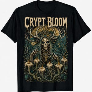 May include: A black t-shirt featuring a graphic print with the text CRYPT BLOOM at the top. The design depicts a skeletal figure with large antlers, surrounded by tangled vines and five lit candles with dripping wax, rendered in muted earth tones.