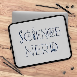 May include: A light gray laptop sleeve with a black border featuring the dark blue text SCIENCE NERD. The letters are stylized with scientific symbols including an integral sign, a test tube, an atom, a resistor, and an Erlenmeyer flask.