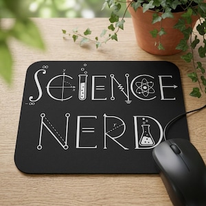 May include: A rectangular black mouse pad featuring the white text SCIENCE NERD. The letters are stylized with scientific and mathematical symbols, including a test tube, an atom, an infinity sign, and geometric equations on a dark background.