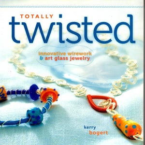 May include: A book titled "Totally Twisted: Innovative Wirework & Art Glass Jewelry" by Kerry Bogert. The cover features a colorful glass bead necklace with blue, orange, and white beads.
