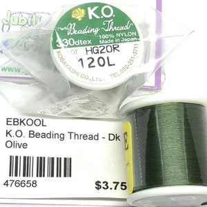 May include: A spool of dark green K.O. Beading Thread, 120L, 30dtex, HG20R, 100% nylon, made in Japan. The spool is labeled with the brand name, product details, and a barcode. The price is $3.75.