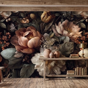 May include: A wall mural featuring a dark, moody floral pattern with large, blooming peonies in shades of dusty pink, cream, and deep orange against a black background. The mural is displayed behind a wooden console table and a wooden bench.