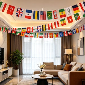 May include: A decorative string of multiple international flags and soccer-themed pennants draped across the ceiling of a living room. The colorful triangular and rectangular flags feature various national emblems and sports graphics.