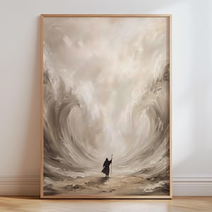 May include: A framed wall art print featuring a monochromatic beige and cream illustration of a solitary figure standing on a sandy shore, holding a staff while facing two massive, swirling waves that rise high on either side of the central character.