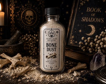 May include: A clear glass bottle with a black cap containing beige powder, labeled Alien Aloe Alchemy Bone Dust, Collected from Saint Augustine, Florida, 3 oz. The label features a graphic of bones and celestial symbols in black ink.