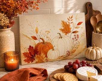 May include: A rectangular canvas print featuring a watercolor illustration of three pumpkins in shades of orange and white, surrounded by autumn foliage, maple leaves, and berries. The artwork displays a warm, seasonal color palette of gold, red, and brown.