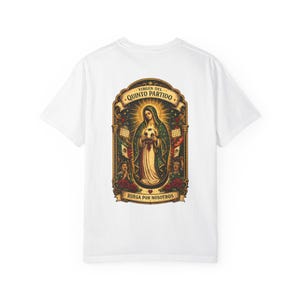 May include: White t-shirt featuring a detailed graphic of a religious figure holding a soccer ball, framed by ornate banners and roses. The text on the shirt reads "Virgen del Quinto Partido" and "Ruega Por Nosotros".