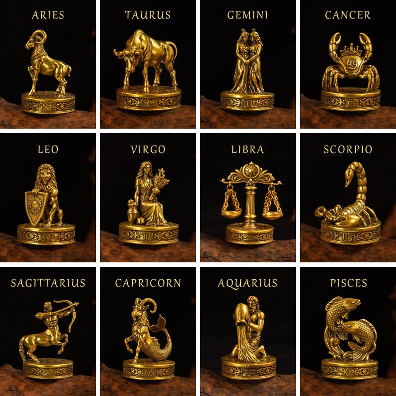 May include: A collection of twelve gold-colored zodiac figurines, each mounted on a circular base with intricate relief patterns. The set includes Aries, Taurus, Gemini, Cancer, Leo, Virgo, Libra, Scorpio, Sagittarius, Capricorn, Aquarius, and Pisces.