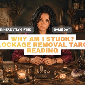 May include: A person with dark hair wearing a deep red garment sits at a wooden table with candles, crystals, and a metal chalice. Text overlays read: INHERENTLY GIFTED, SAME DAY, WHY AM I STUCK? BLOCKAGE REMOVAL TAROT READING in bold yellow and white.