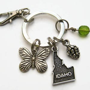 Porte-clé personnalisé de l'Idaho, tirette de carte de l'État des États-Unis, accessoire personnalisé pomme de pin, lanière de porte-clé géographie, cadeau du nord-ouest du Pacifique