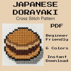 以下が含まれることがあります： 日本のどら焼きをモチーフにしたクロスステッチ図案。濃い茶色の餡が入った丸いパンケーキのようなお菓子が描かれています。テキストには「JAPANESE DORAYAKI Cross Stitch Pattern, PDF, Beginner Friendly, 6 Colors, Instant Download」と白い布地に記されています。