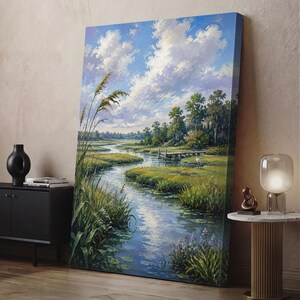 May include: A vertical canvas painting depicting a serene marshland landscape with a winding stream, tall green grasses, and a wooden dock. The scene features a white heron standing near the water under a bright blue sky filled with fluffy white clouds.