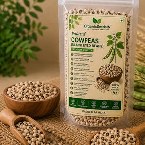 May include: A clear plastic pouch of OrganicSeedsIN brand natural cowpeas, also known as black-eyed beans. The label features green text and graphics, including a plant illustration. The pouch is surrounded by wooden bowls and scoops filled with the small, cream-colored beans with distinct black spots, set against a textured surface.