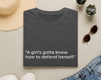 A Girl's Gotta Know How to Defend Herself Tee | Feminist Reader Apparel Shirt