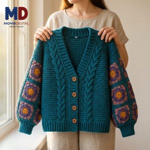 May include: A teal crochet cardigan featuring a V-neckline, four brown buttons, and vertical cable knit patterns on the front. The sleeves are constructed from square granny motifs in shades of purple, yellow, and teal with ribbed cuffs.