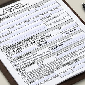 May include: A State of California Department of Justice Request for Live Scan Service form on a brown clipboard with a black pen. The document includes sections for applicant information, contributing agency details, and CCW permit application.