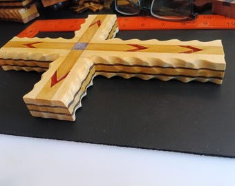 Artistically crafted wall cross.