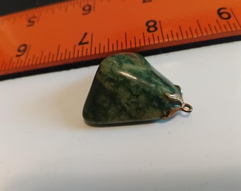 Polished jade pendant